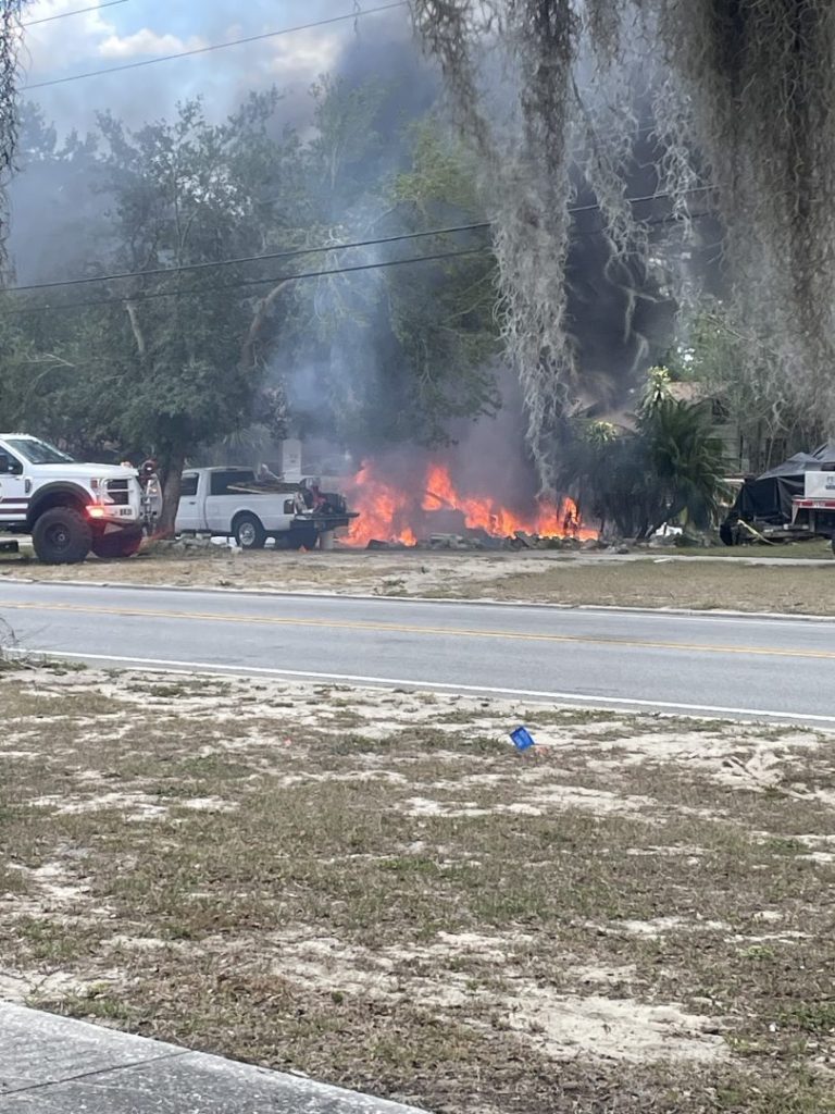 Vehicle Fire Sets Yard Ablaze, Shuts Down Scenic Hwy